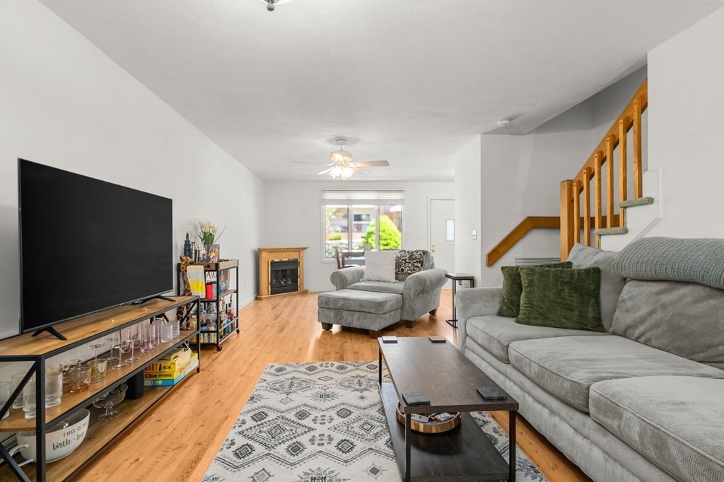 53 South Walnut Street, Unit 2 Quincy, MA 02169 - Photo 7 of 24 a living room with furniture and a flat screen tv