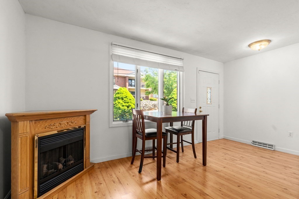 53 South Walnut Street, Unit 2 Quincy, MA 02169 - Photo 9 of 24 a dining room with furniture and wooden floor