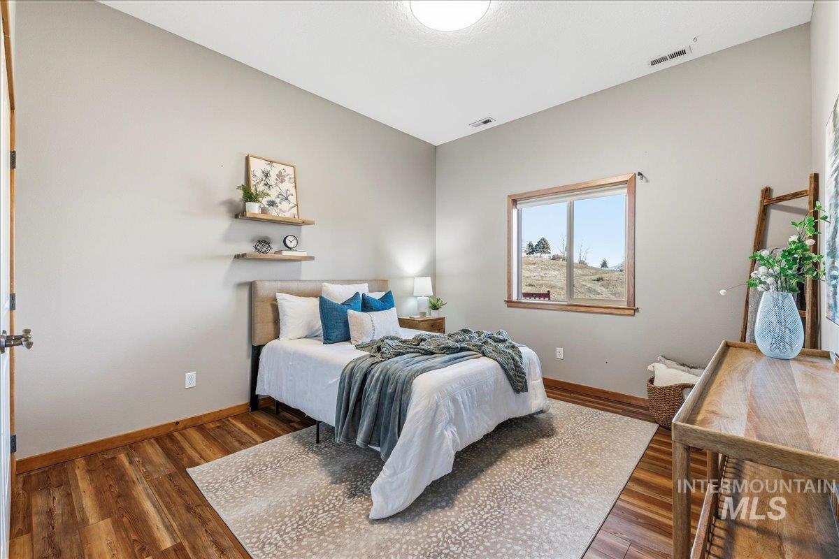 7434 Lanktree Lane Middleton, ID 83644 - Photo 17 of 34 Bedroom with baseboards and wood finished floors
