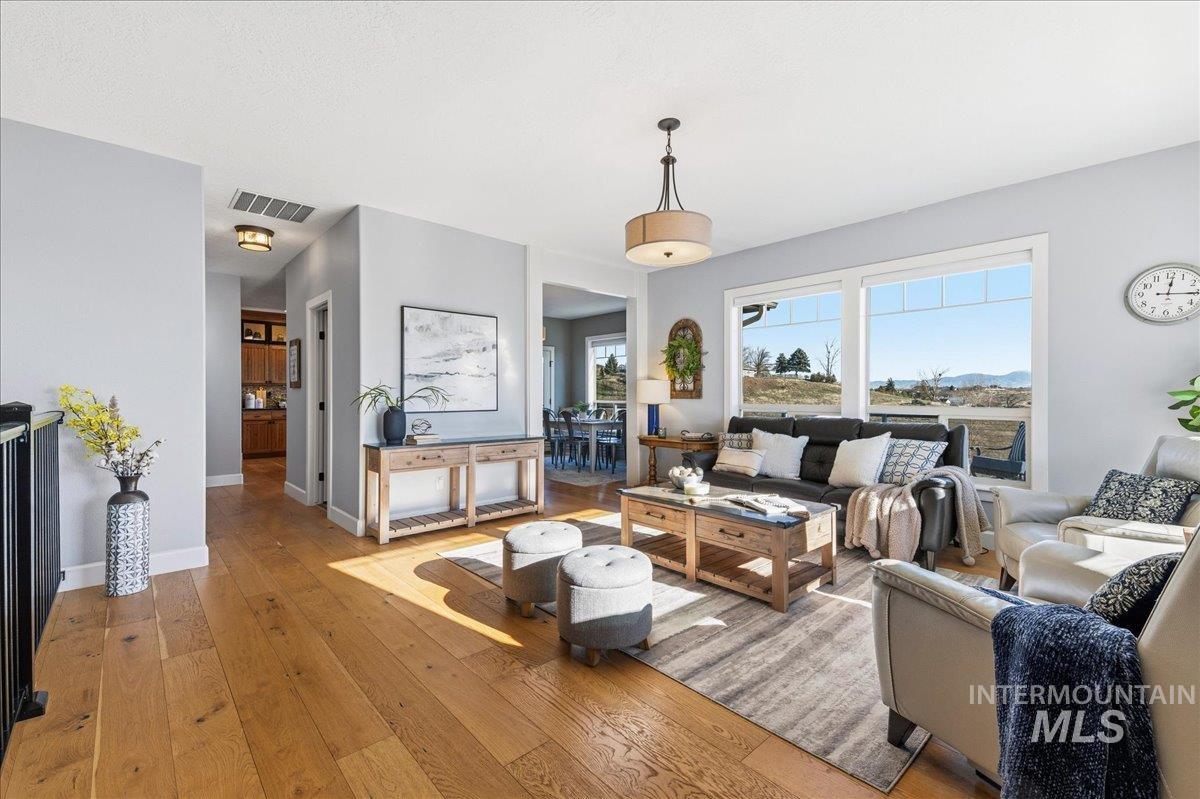 7434 Lanktree Lane Middleton, ID 83644 - Photo 5 of 34 Living area with light wood finished floors and baseboards