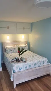 a bedroom with a bed and window