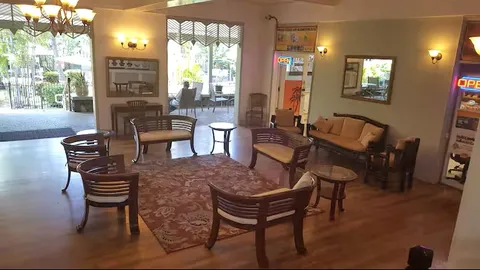 a view of a livingroom with furniture window and wooden floor