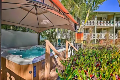 a view of an house with backyard and sitting area