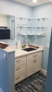 a kitchen with a sink and cabinets