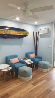 a bathroom with a sink mirror and toilet