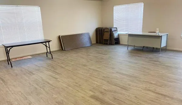 a view of workspace and window with rug