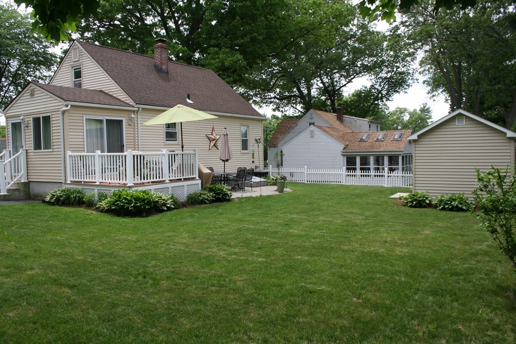 252 Cooper Street Springfield, MA 01108 - Photo 4 of 22 a view of a house with a yard and sitting area