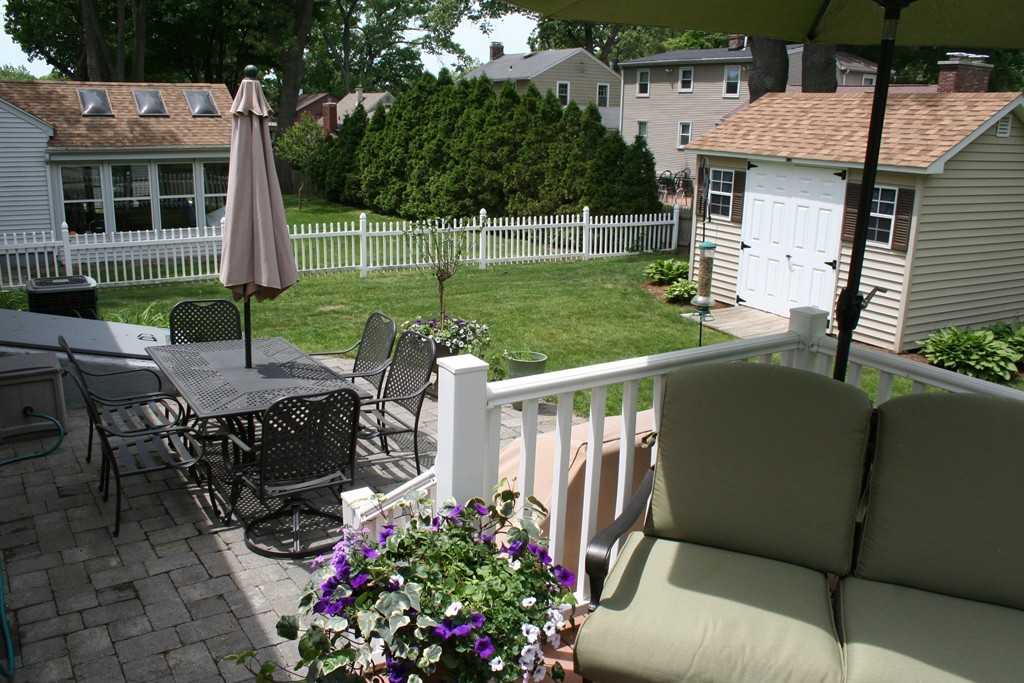 252 Cooper Street Springfield, MA 01108 - Photo 8 of 22 a view of a patio with couches table and chairs and potted plants