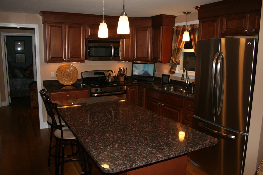 252 Cooper Street Springfield, MA 01108 - Photo 10 of 22 a kitchen with table and chairs