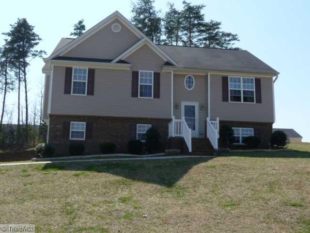 6907 Channel Forest Road Belews Creek, NC 27009 - Photo 1 of 14 Exterior Front. Low Maintenance brick & vinyl exterior, vinyl front railings and storm door. Notice the lovely oval window adds plenty of natural light in the foyer! USDA 100% Financing