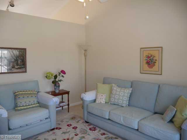 6907 Channel Forest Road Belews Creek, NC 27009 - Photo 2 of 14 Living Room. Vaulted ceiling, ceiling fan, neutral decor, and windows that let in plenty of sunlight ... waiting for your decorating touches!
