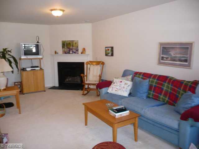 6907 Channel Forest Road Belews Creek, NC 27009 - Photo 5 of 14 Den/Family/Great Room. Spacious lower level den with fireplace with gas logs. Lowe level also has a 1/2 bath and a laundry room.