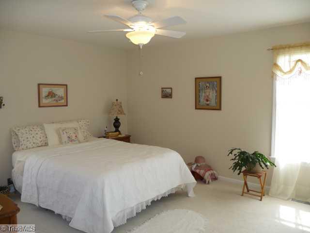 6907 Channel Forest Road Belews Creek, NC 27009 - Photo 7 of 14 Master Bedroom. Large master has a ceiling fan and walk-in closet!