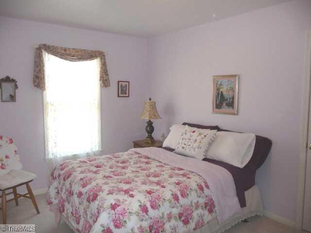 6907 Channel Forest Road Belews Creek, NC 27009 - Photo 9 of 14 2nd Bedroom. Spacious and bright with vinyl tilt windows