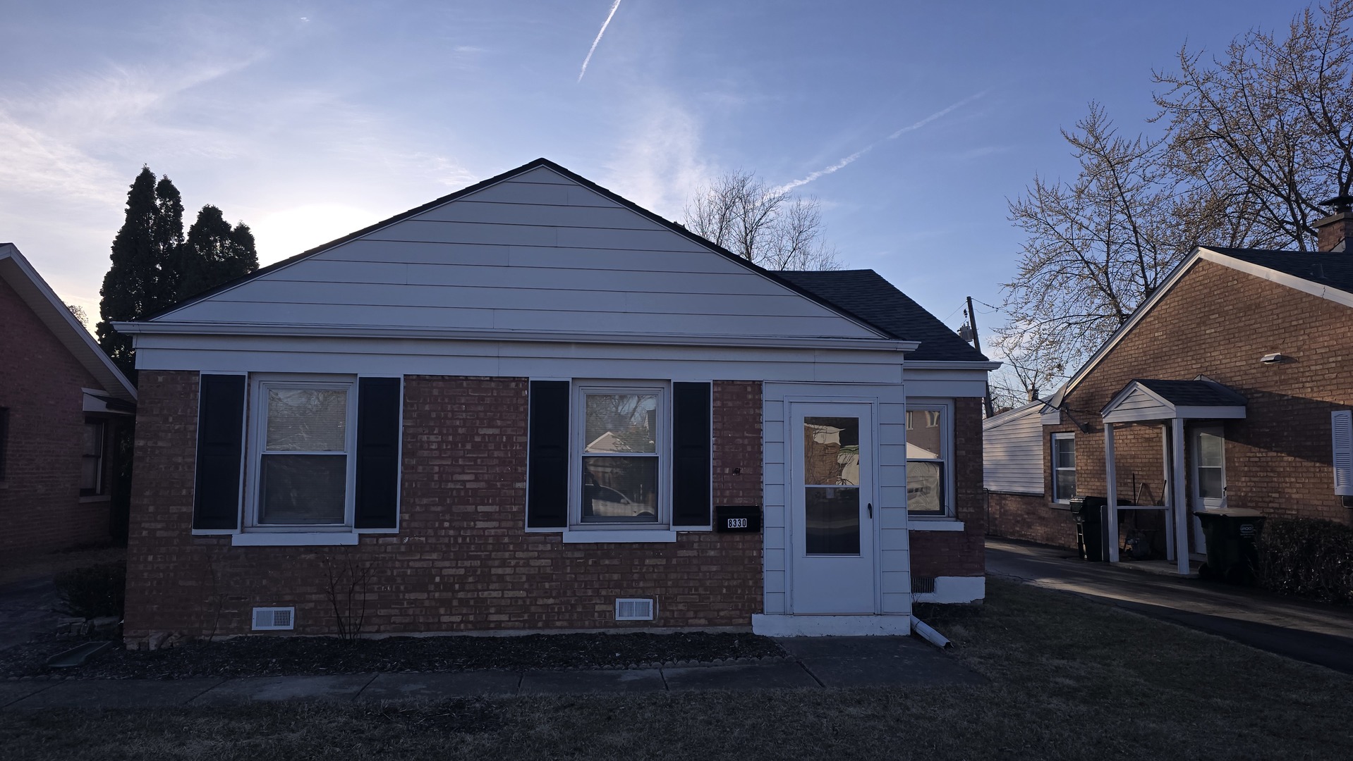 8330 North New England Avenue Niles, IL 60714 - Photo 1 of 20 a front view of a house with yard