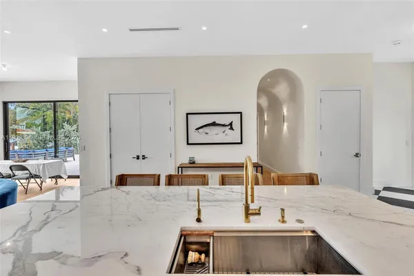 a bathroom with a tub sink and mirror
