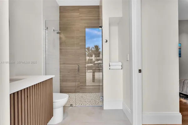 a bathroom with a toilet and shower
