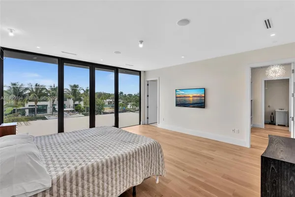 a spacious bathroom with a mirror and shower