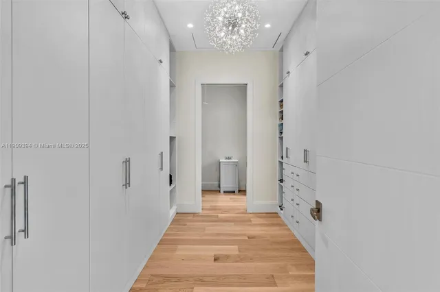 a spacious bathroom with a mirror and shower