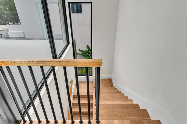 a view of a house with a garden and plants