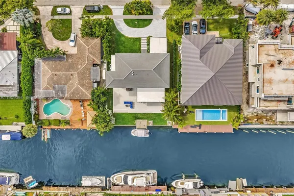 an aerial view of residential houses with outdoor space