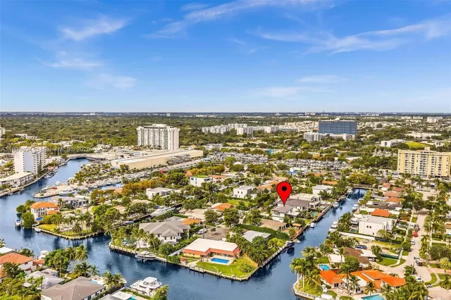 an aerial view of residential building and lake