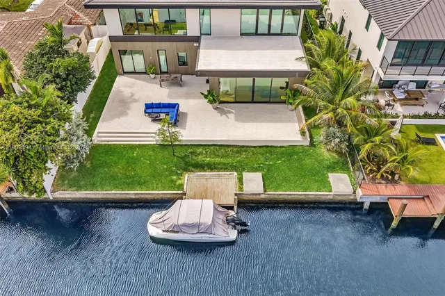 a view of a chair and table in backyard