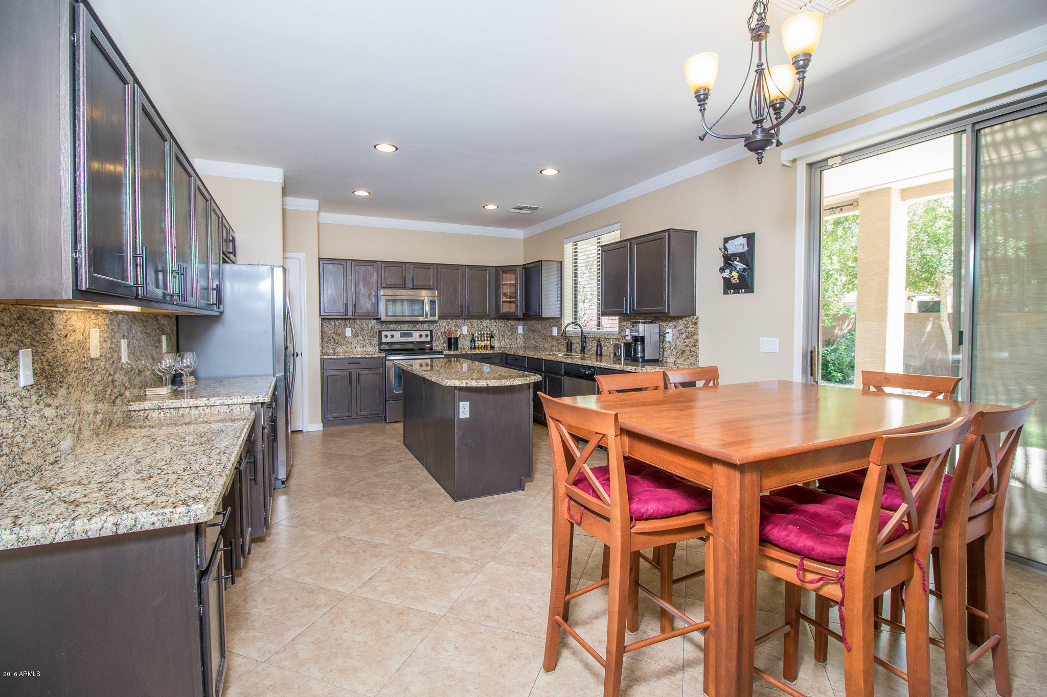 13549 West Calavar Road Surprise, AZ 85379 - Photo 8 of 31 8) DINING TO KITCHEN