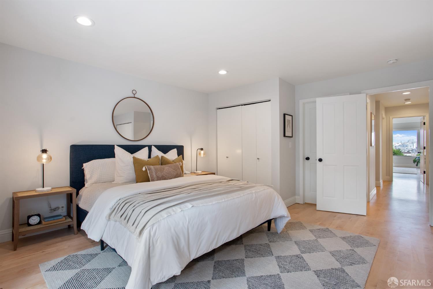 251 Ripley Street San Francisco, CA 94110 - Photo 14 of 39 a bedroom with a bed and painting on the wall
