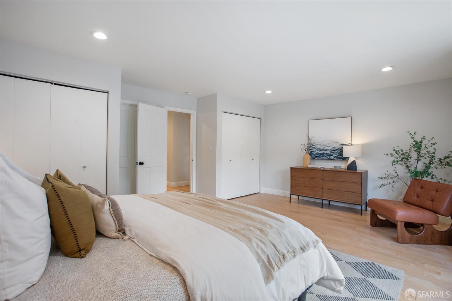 251 Ripley Street San Francisco, CA 94110 - Photo 17 of 39 a bedroom with a bed and a chair