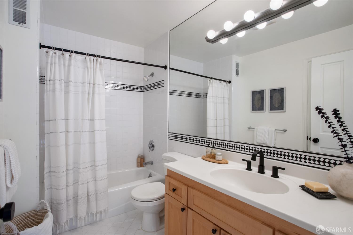 251 Ripley Street San Francisco, CA 94110 - Photo 18 of 39 a bathroom with a sink a toilet and shower