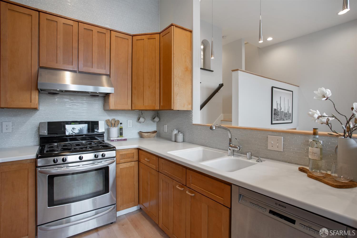 251 Ripley Street San Francisco, CA 94110 - Photo 25 of 39 a kitchen with a sink stove and cabinets