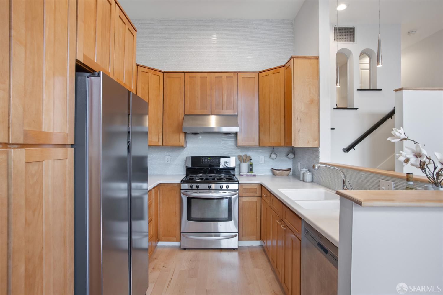 251 Ripley Street San Francisco, CA 94110 - Photo 26 of 39 a kitchen with stainless steel appliances granite countertop a refrigerator stove and sink
