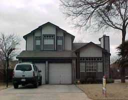 a front view of a house with parking