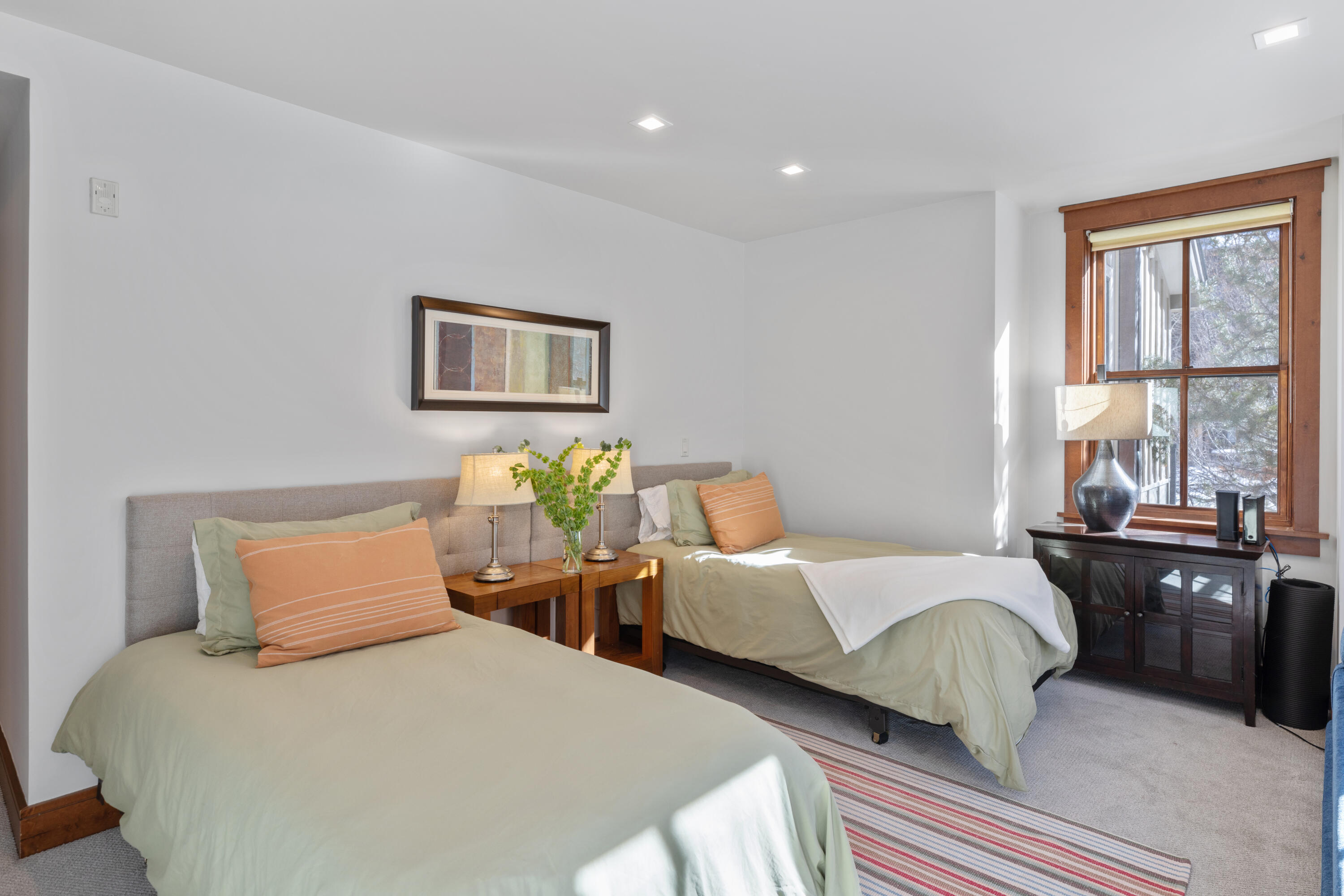 230 South Pine Street, Unit R 102 Telluride, CO 81435 - Photo 10 of 14 a bedroom with two beds and large windows