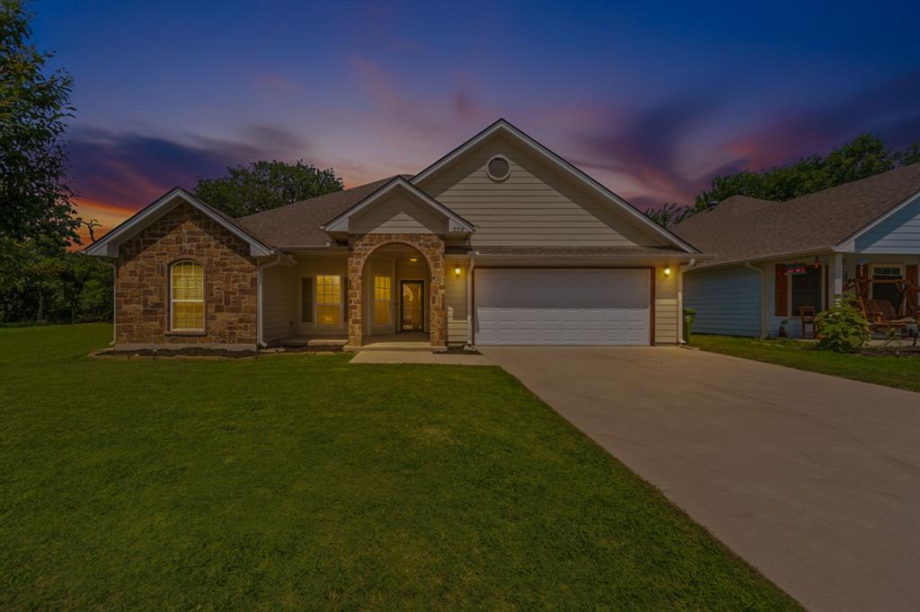 229 Firefly Drive Springtown, TX 76082 - Photo 2 of 33 Single-story residence featuring a stone and siding exterior