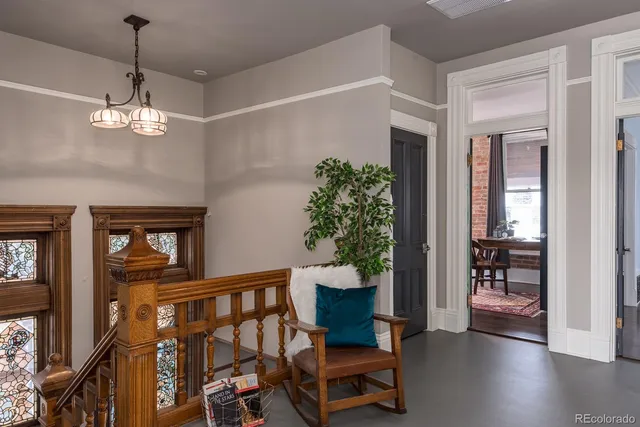 a view of a livingroom with furniture and hardwood floor