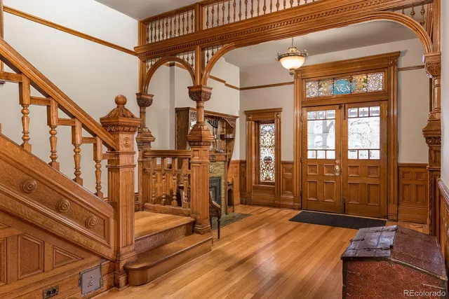 a view of an entryway with wooden floor