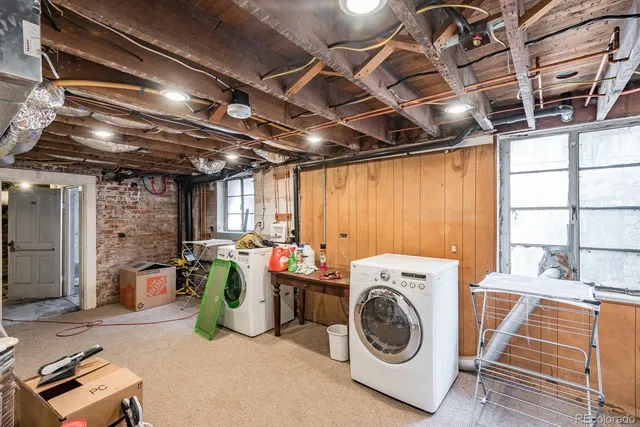 a view of a brick house with a sink and dishwasher