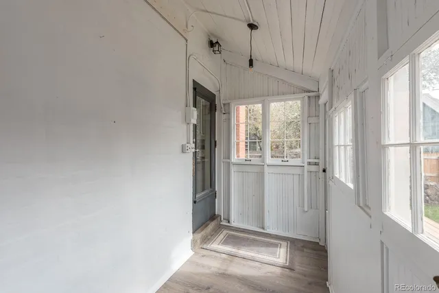 a view of a house with a yard and sitting area