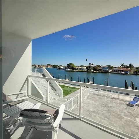 a view of a balcony with chairs