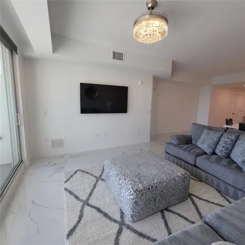 a living room with a couch and a flat screen tv