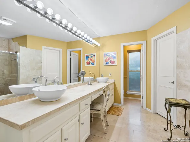 a dining room with a table and chairs