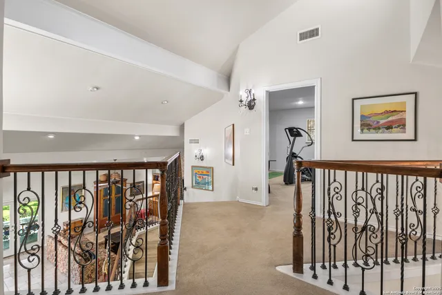 a view of a hallway with a livingroom