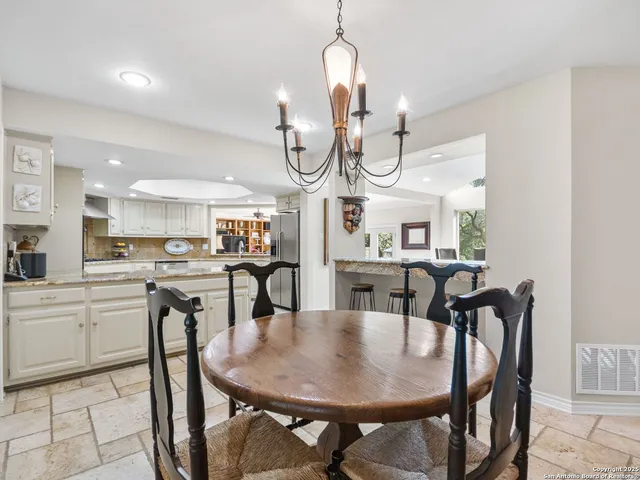 a kitchen with a refrigerator and a sink