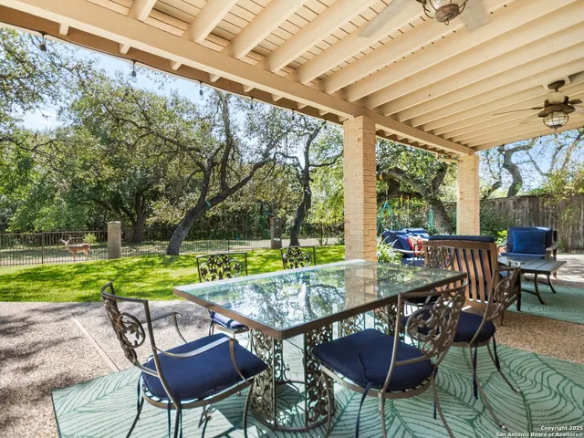 a view of yard with patio
