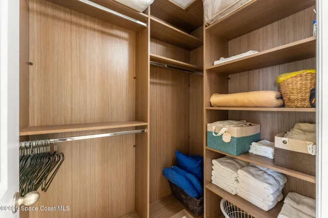 a bathroom with a granite countertop sink a toilet and with mirror