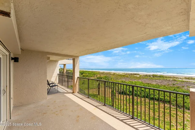 a view of a swimming pool with a lounge chairs