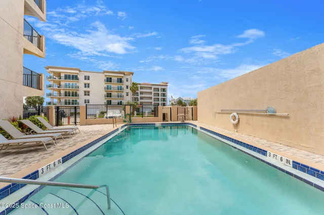 a view of a street with a building in the background