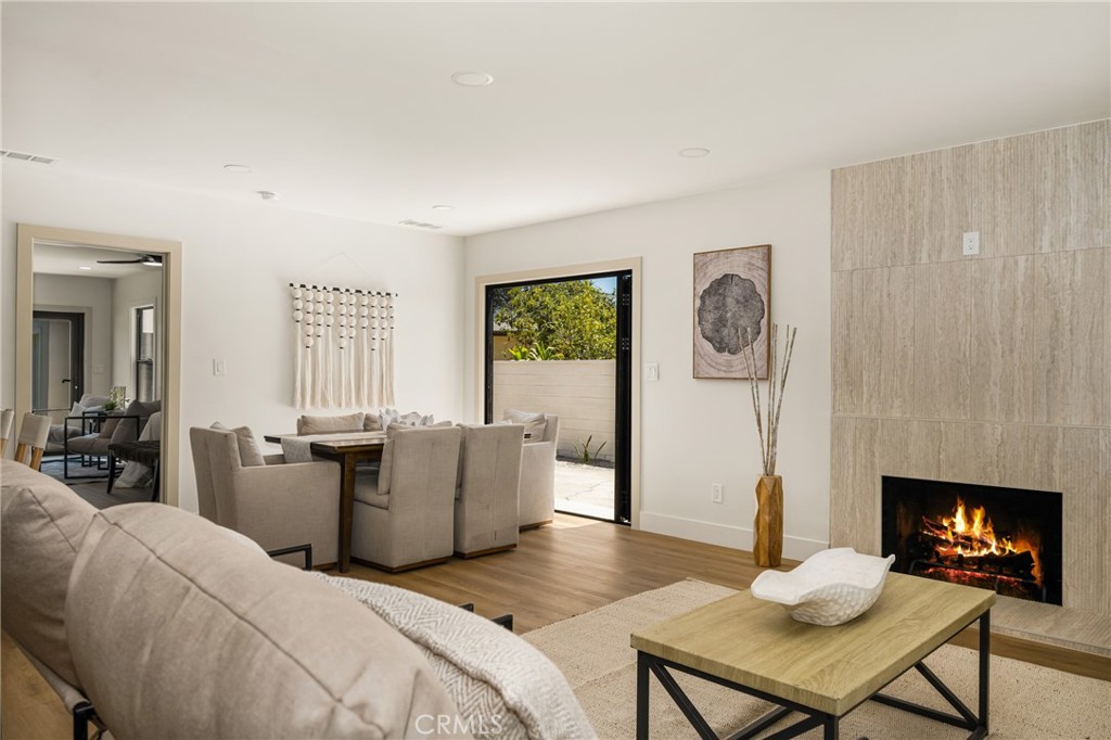 2680 Chatwin Avenue Long Beach, CA 90815 - Photo 16 of 61 a living room with furniture and a fireplace